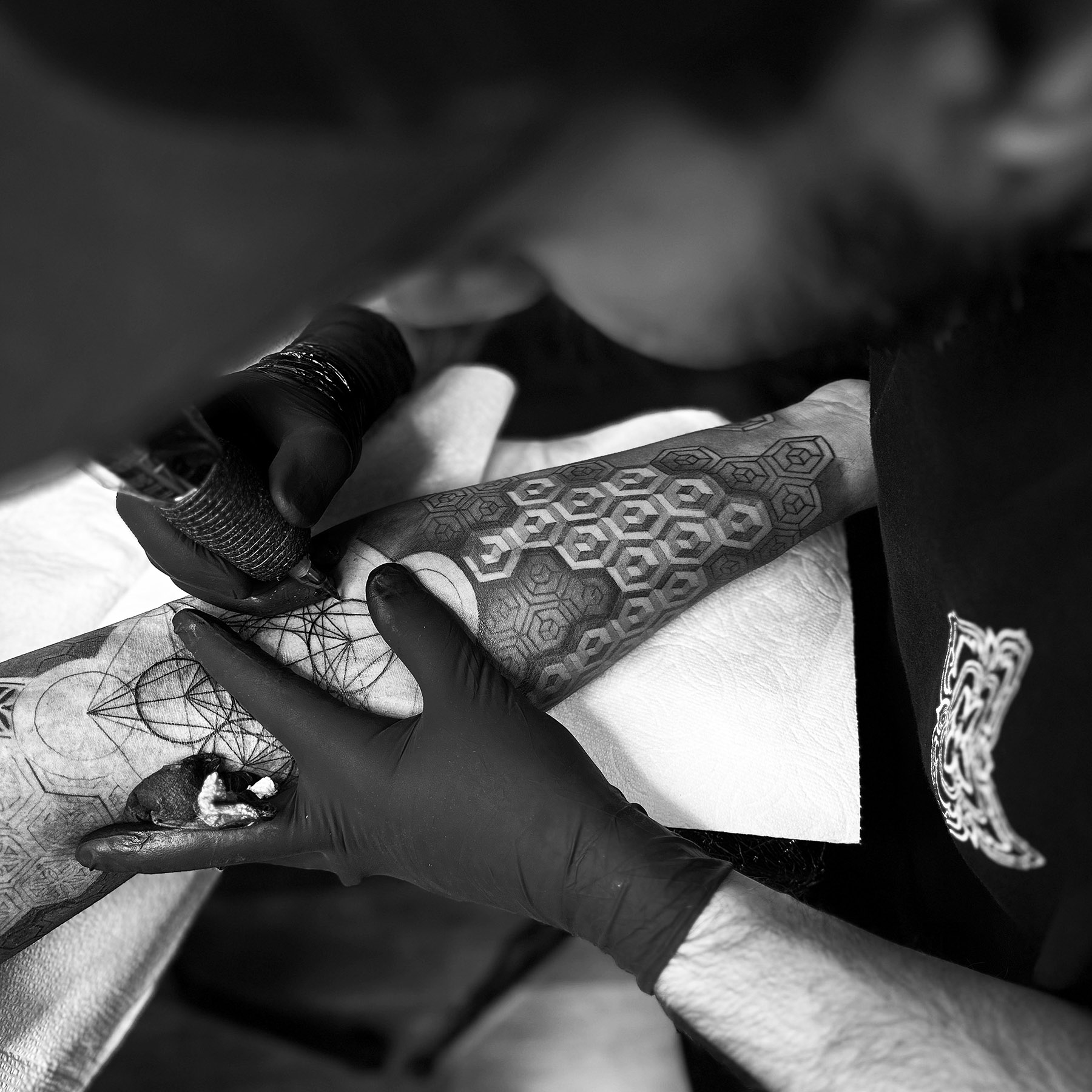 Me tattooing a black geometric tattoo design and a Metatron in San Diego.